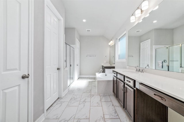 bathroom featuring vanity and separate shower and tub