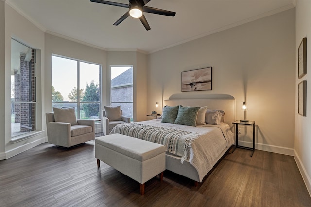 bedroom with dark hardwood / wood-style flooring, ceiling fan, and crown molding