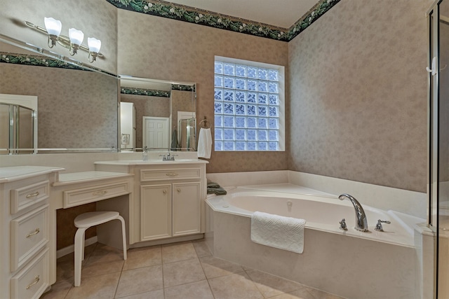 bathroom with tile patterned floors, vanity, and separate shower and tub