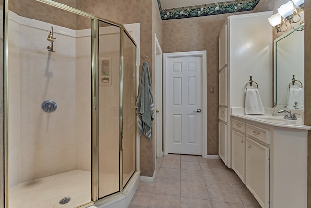 bathroom with tile patterned flooring, vanity, and an enclosed shower