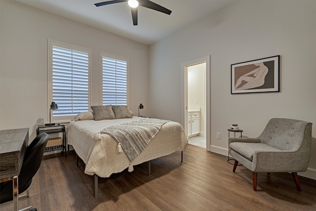 bedroom with ceiling fan, dark hardwood / wood-style flooring, and connected bathroom