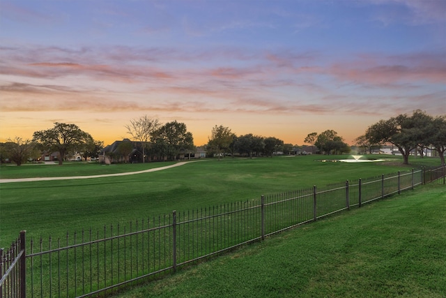 view of yard at dusk