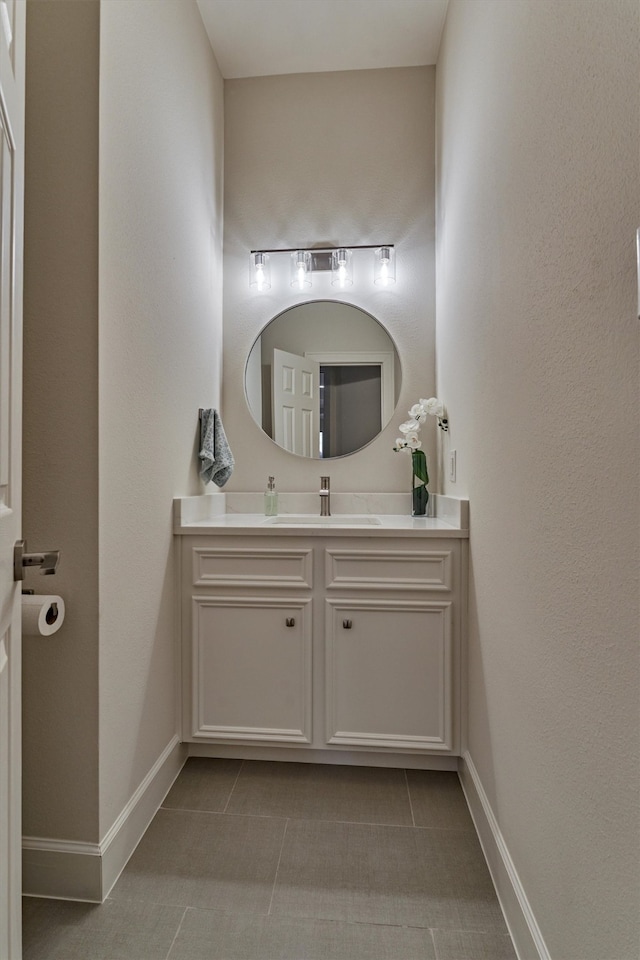 bathroom with tile patterned flooring and vanity