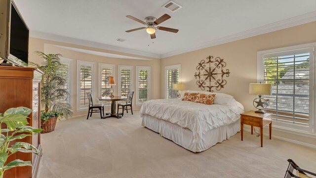 bedroom with light carpet, crown molding, and ceiling fan