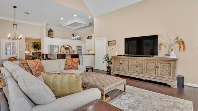 living room with crown molding, dark hardwood / wood-style flooring, a chandelier, and high vaulted ceiling