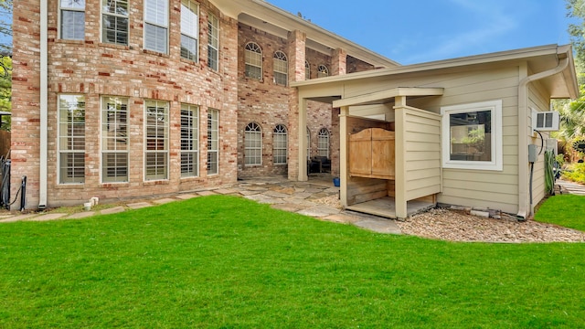 rear view of property featuring a yard