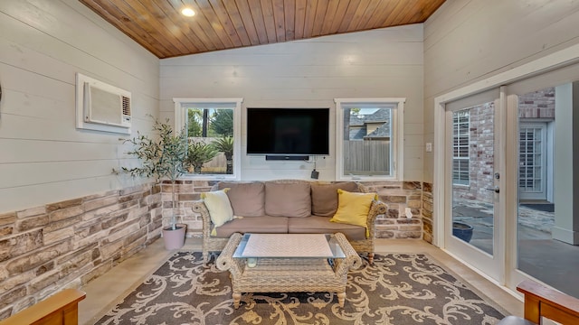 interior space featuring vaulted ceiling, an AC wall unit, and wooden ceiling