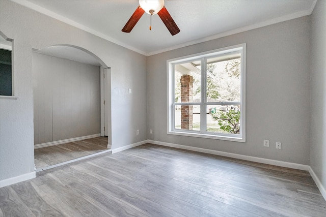 interior space with a closet, ceiling fan, light hardwood / wood-style flooring, and ornamental molding