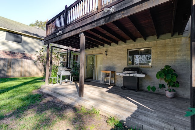 wooden terrace featuring grilling area