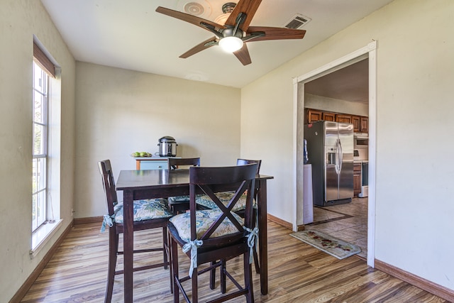 dining room featuring ceiling fan and wood-type flooring