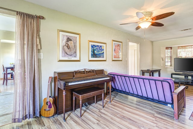 miscellaneous room with light hardwood / wood-style flooring and ceiling fan