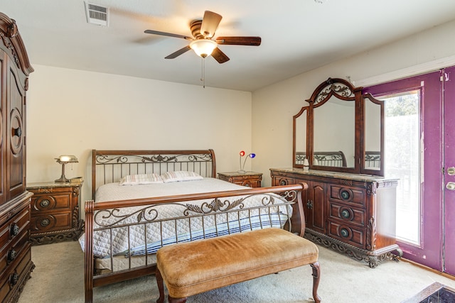 bedroom featuring light colored carpet and ceiling fan