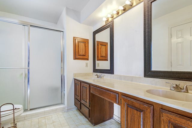 bathroom with vanity, tile patterned floors, and an enclosed shower