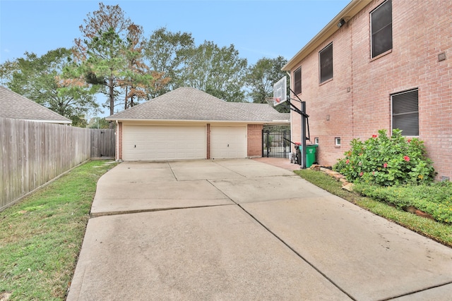 view of home's exterior featuring a garage and an outbuilding