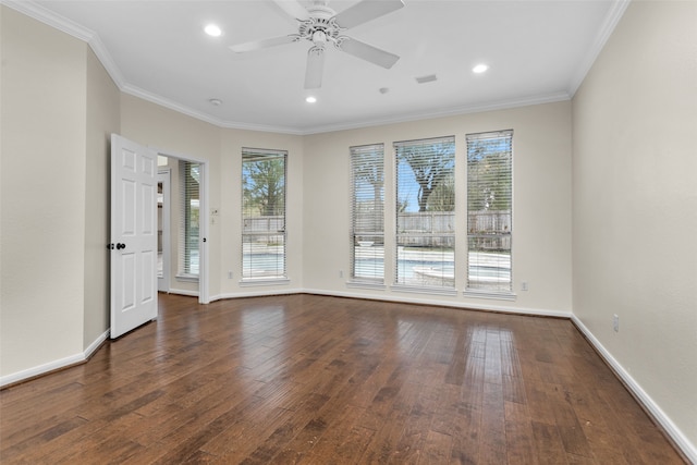 unfurnished room featuring ceiling fan, dark hardwood / wood-style flooring, ornamental molding, and a wealth of natural light