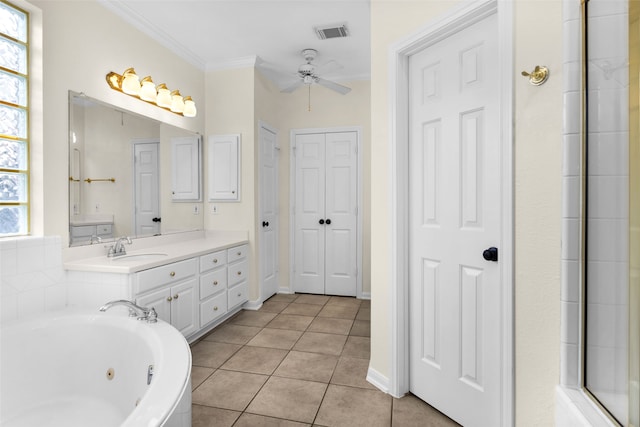 bathroom featuring tile patterned floors, ornamental molding, vanity, ceiling fan, and a tub