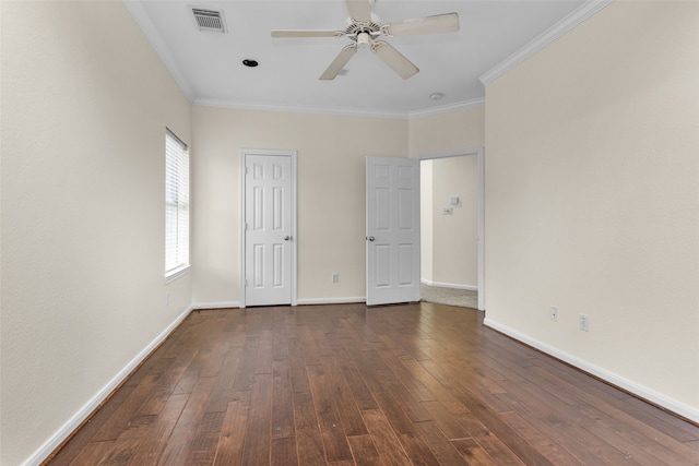 unfurnished room featuring dark hardwood / wood-style floors, ceiling fan, and ornamental molding