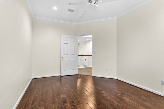 empty room with ceiling fan, dark hardwood / wood-style flooring, and crown molding