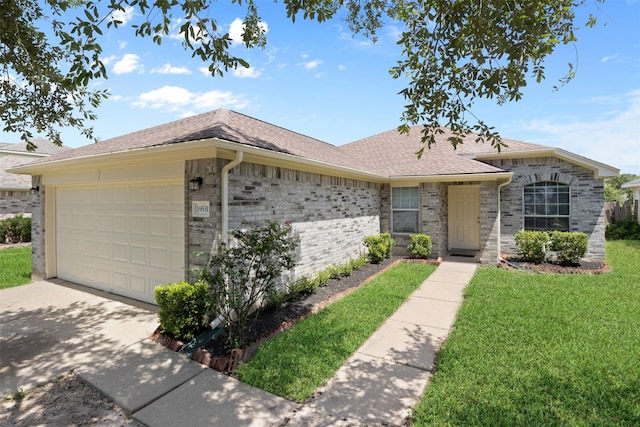 ranch-style house featuring a garage and a front lawn