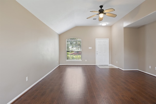 empty room with dark hardwood / wood-style floors, ceiling fan, and vaulted ceiling