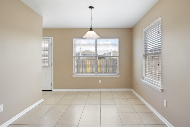 unfurnished dining area with light tile patterned floors