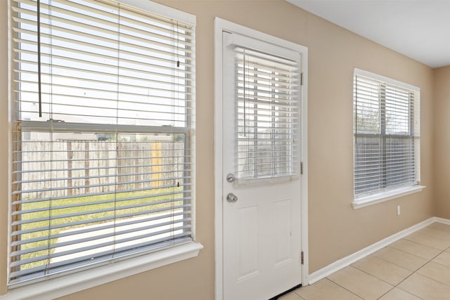 doorway to outside featuring light tile patterned floors