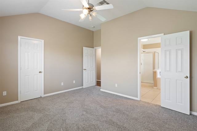 unfurnished bedroom with light carpet, vaulted ceiling, and ceiling fan