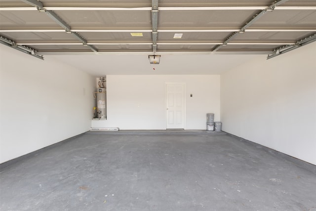 garage featuring a garage door opener and gas water heater