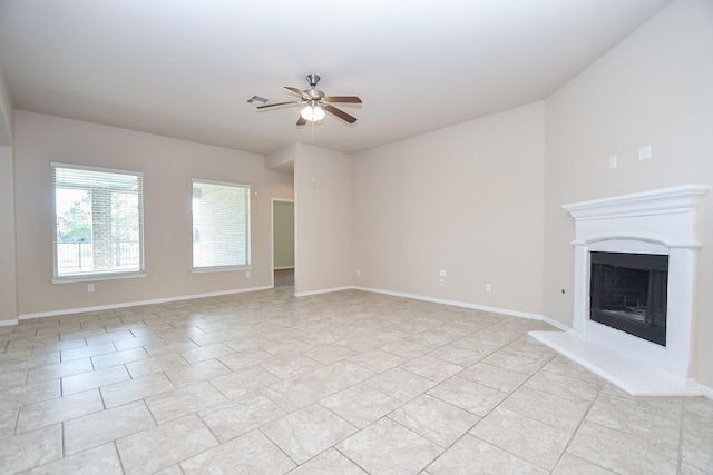 unfurnished living room featuring ceiling fan