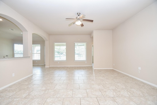 unfurnished room with ceiling fan