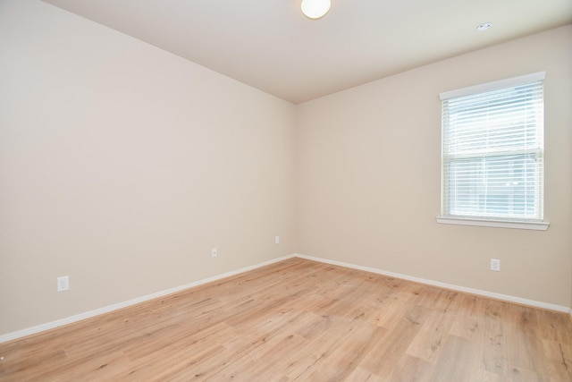 unfurnished room featuring light hardwood / wood-style floors