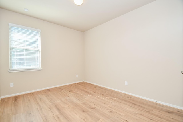 empty room with light hardwood / wood-style floors