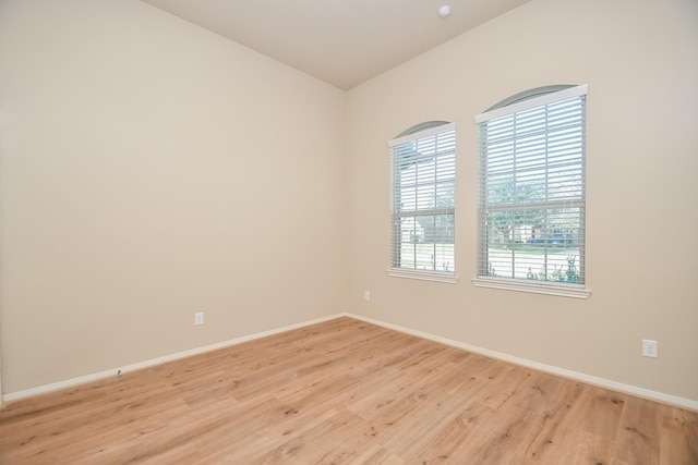 empty room with light hardwood / wood-style floors