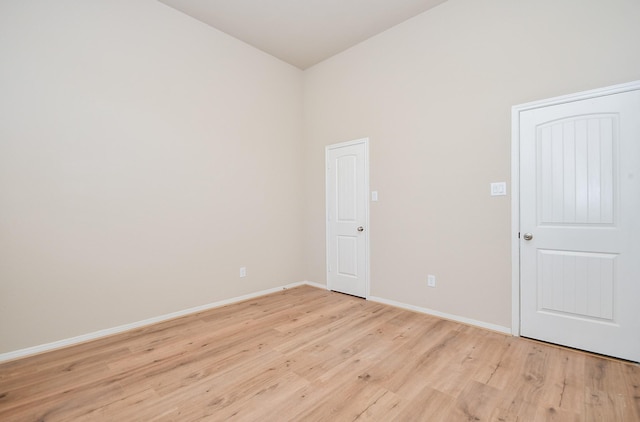 empty room with light hardwood / wood-style floors