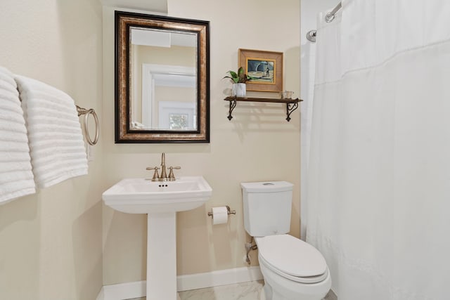 bathroom with sink and toilet