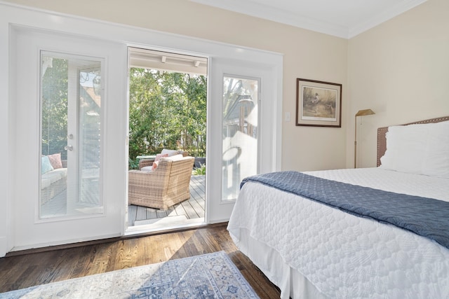 bedroom featuring access to outside, crown molding, and dark hardwood / wood-style flooring