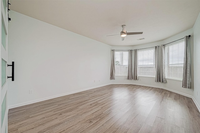 unfurnished room featuring ceiling fan and light hardwood / wood-style floors