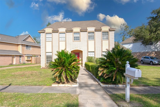 view of front of home with a front lawn