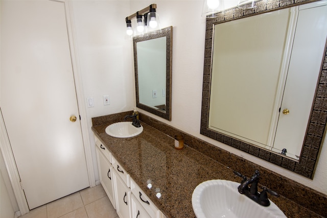 bathroom with tile patterned flooring and vanity