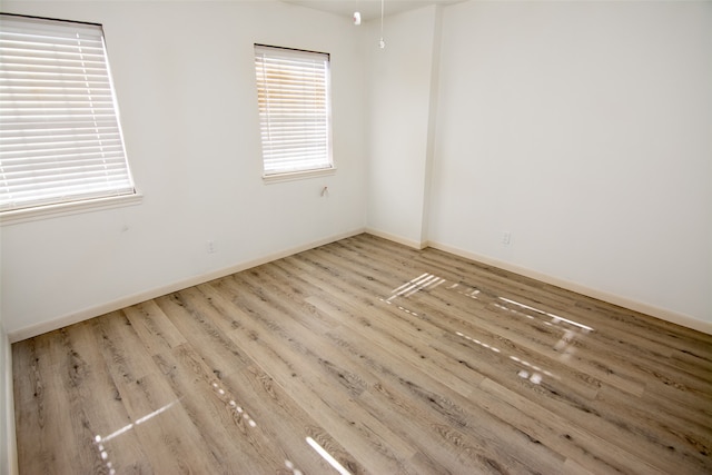 unfurnished room featuring light wood-type flooring