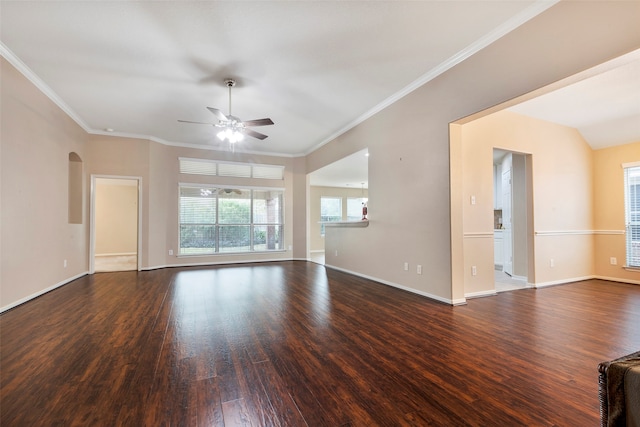 unfurnished living room featuring dark hardwood / wood-style floors, ceiling fan, and crown molding