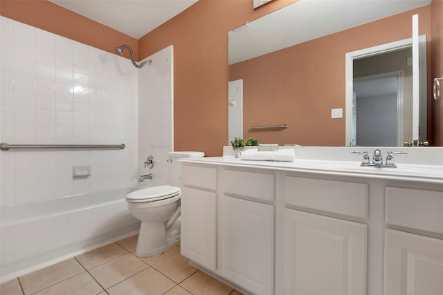 full bathroom with tile patterned floors, vanity, toilet, and tiled shower / bath