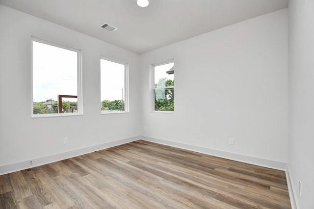 empty room with light hardwood / wood-style floors