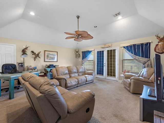 carpeted living room with ceiling fan, french doors, and vaulted ceiling