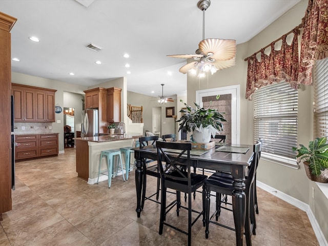 dining room featuring ceiling fan