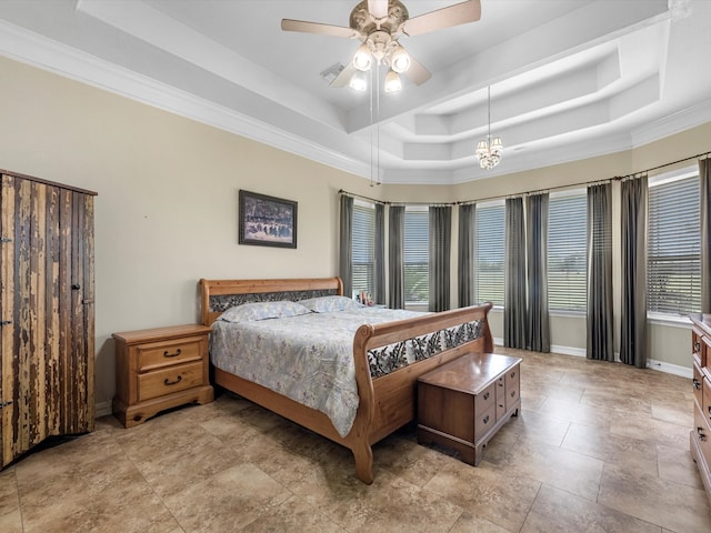 bedroom with a tray ceiling, ceiling fan, and crown molding