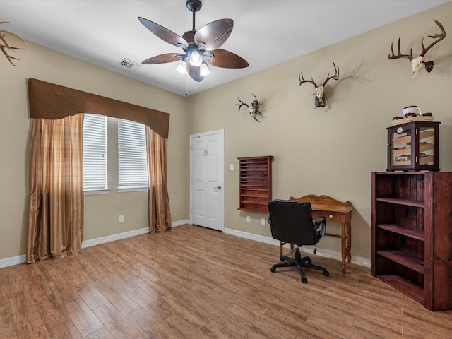 office featuring hardwood / wood-style flooring and ceiling fan