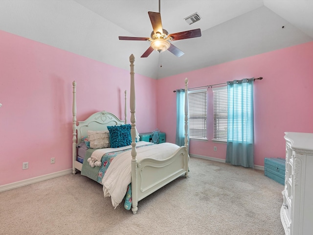 bedroom with ceiling fan, light carpet, and vaulted ceiling