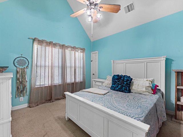 carpeted bedroom with ceiling fan and high vaulted ceiling