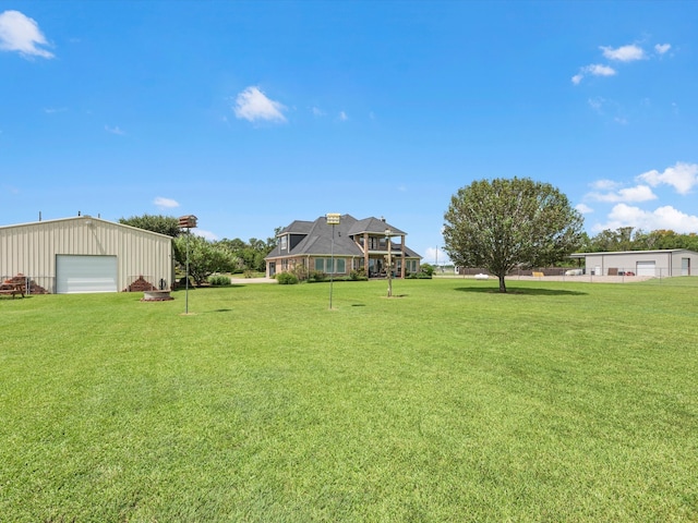 view of yard with an outbuilding and a garage